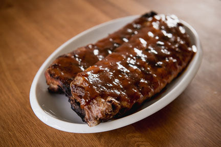 Grilled Baby Back Pork Ribs with Peach Barbecue Sauce
